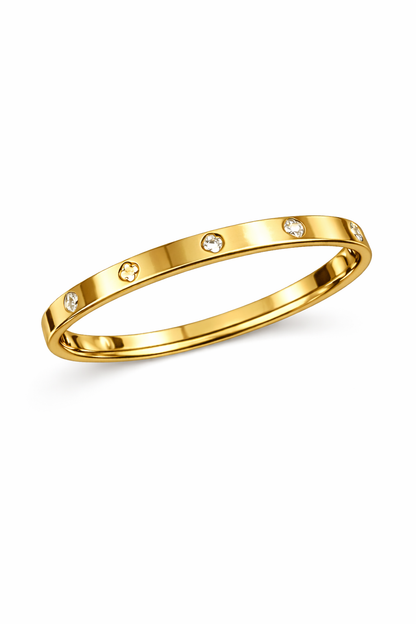 Gold ring with small diamonds on a white background