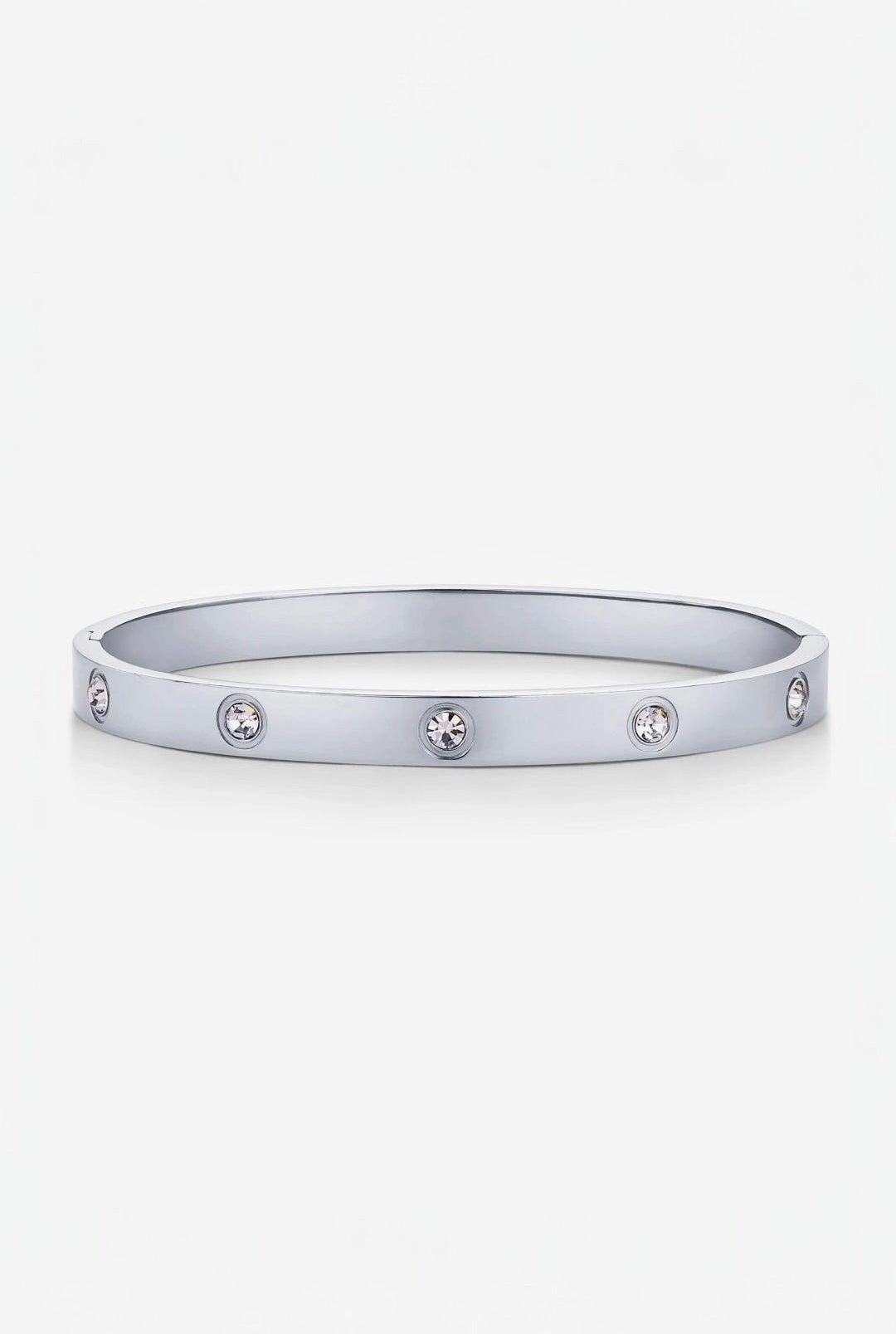 Silver bracelet with embedded stones on a white background