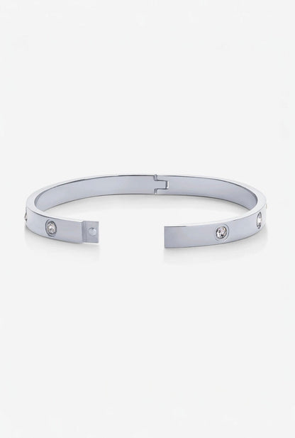 Silver bracelet with small stones on a white background